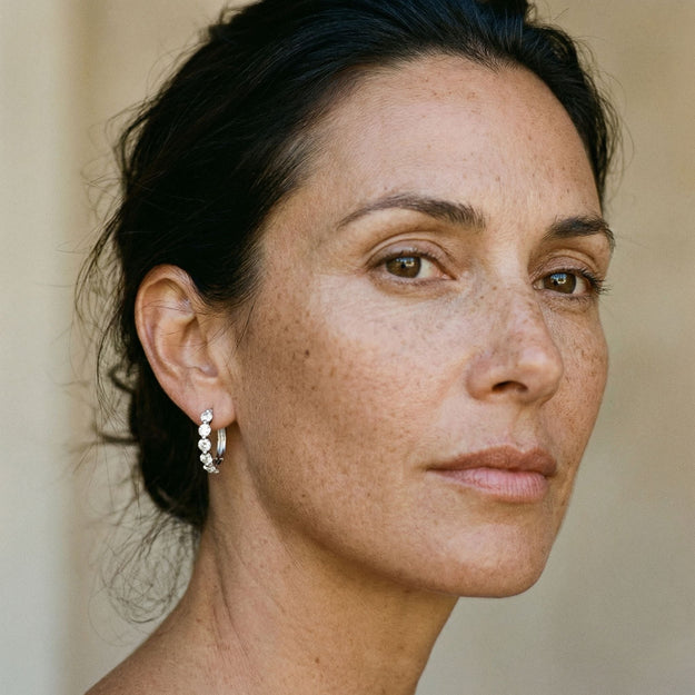 Close-up of a woman's face with a neutral background