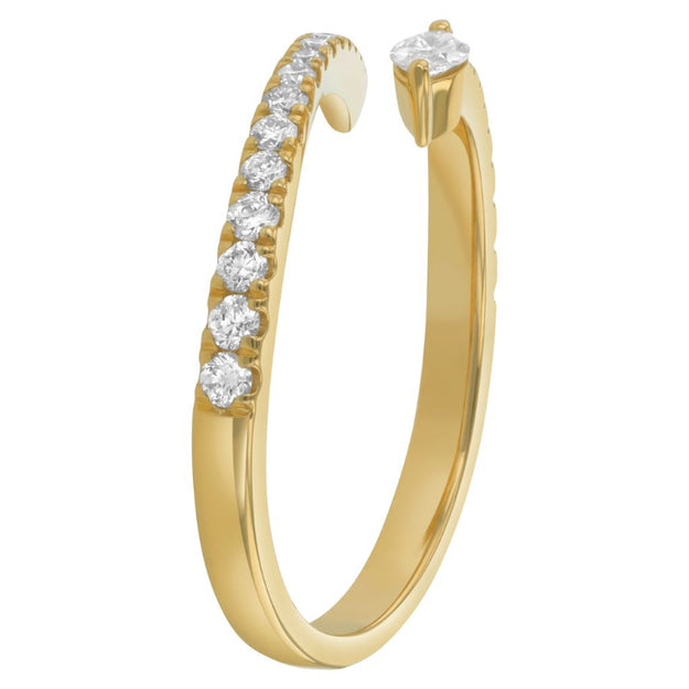 Gold ring with diamonds on a white background